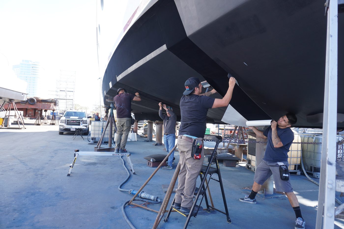 Finsulate wrap being applied to a hull